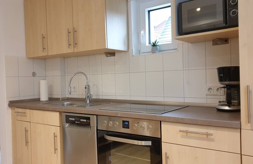 Nordseebad Burhave Apartment | Vacation apartment Meermuschel in Burhave for 2-4 pers. with garden and barbecue by the sea