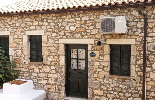 Korithi Villa | Villa set within private courtyard surrounded by mature olive trees
