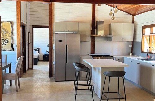 Mbodiene Ski Chalet | Villa Siga Fall ~ Elegant Wooden 2BR Retreat Near la Petite Côte.