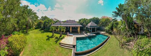 Tamarin Villa | Villa sur le golf avec piscine et jardin tropical