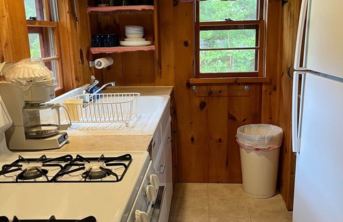 Melvin Village Cottage | Waterfront Lake Winnipesaukee cabins on private sandy beach with dock