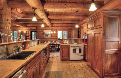 La Minerve Cottage | Waterfront Log Cottage with Hot Tub and Sauna