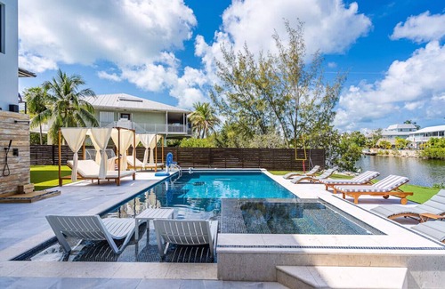 Rock Harbor Villa | Waterfront Luxe Pool, Hot Tub, Theater, Games and More!