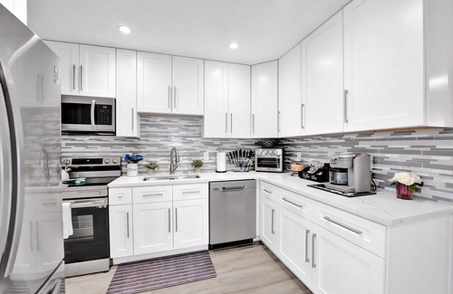 Golfview Harbor House | Waterfront Tropic Oasis: Heated Pool, Pergola, Canal, Dock, Air Hockey!