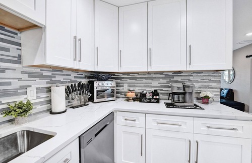 Golfview Harbor House | Waterfront Tropic Oasis: Heated Pool, Pergola, Canal, Dock, Air Hockey!