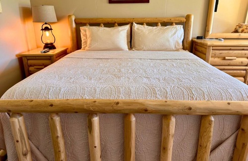Trout Lake Hotel | Welcoming King Room #6 with AC at lakefront Twin Cedars Resort in Trout Lake MI