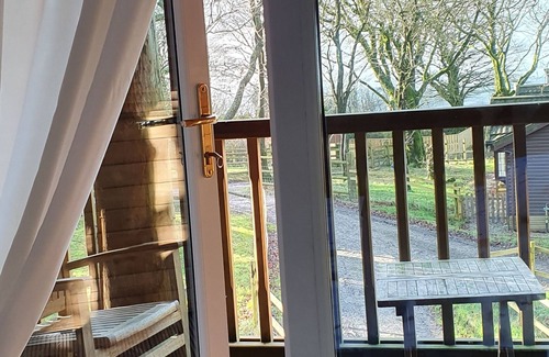Brayford Cabin | Woodpecker Lodge, a secluded log cabin in beautiful north Devon