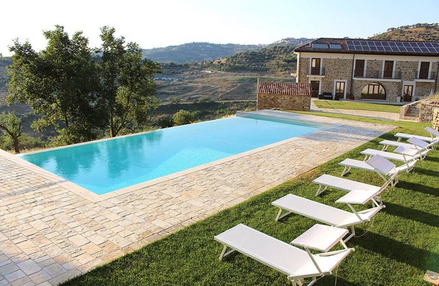A characteristic countryhouse in local stone immersed in the Cilento vineyards