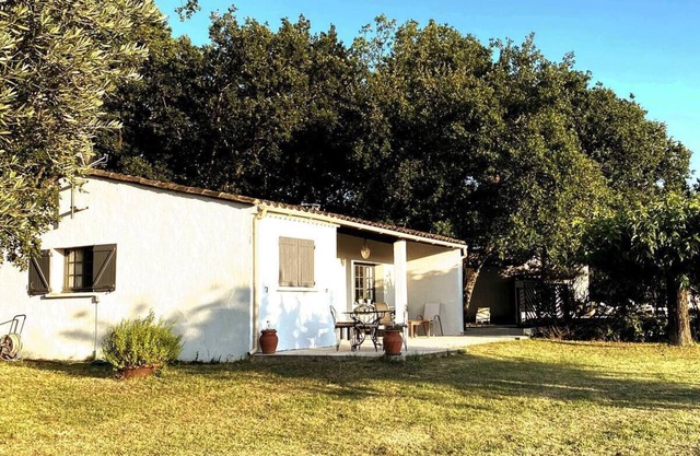 A house among the oaks with a swimming pool.