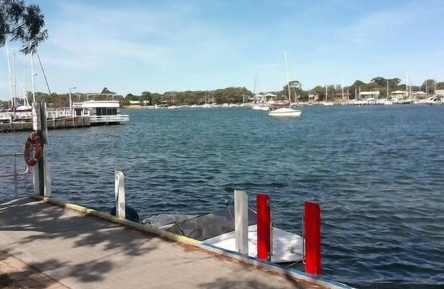 Absolute water frontage with river and jetty at front door and Lake King to rear