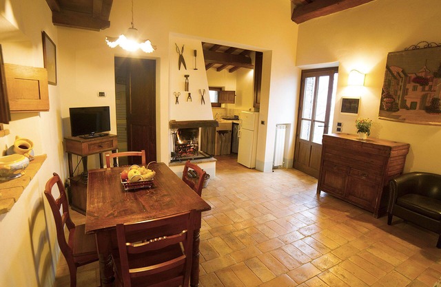 Apartment with garden in old farmhouse with swimming pool