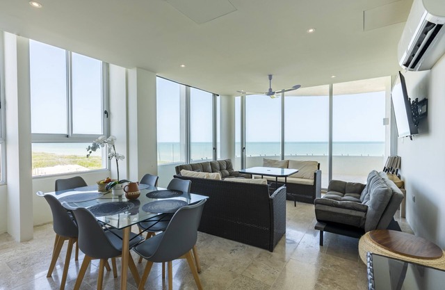 Beachfront apartment with private balcony, heated pool & stunning views