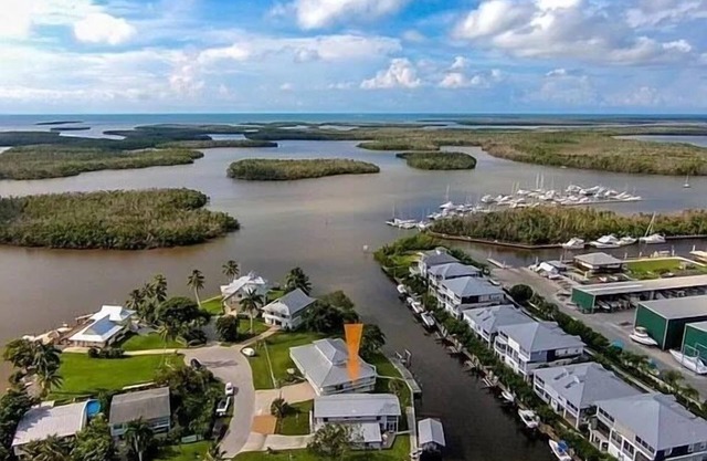 Beautiful canal facing home with inground pool! In charming Goodland Florida!