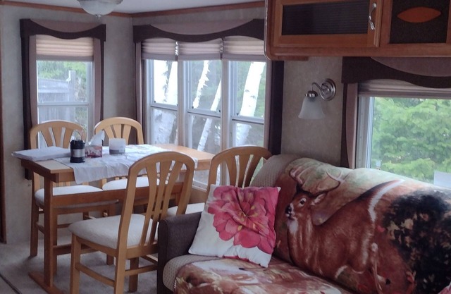 Beautiful location right on the river bank , steps down to the shore and fishing