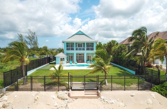 Blue Birds Beach House, right on the beach with a large backyard & heated pool.