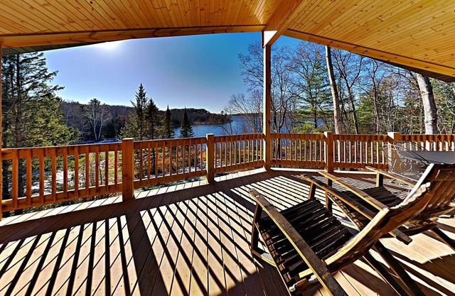 Brand New 5 bedroom Lacourte Orellies lakefront home with covered deck and amazing lake views.