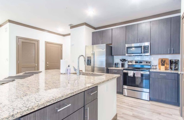 Charming 2BR Retreat | Pool, Parking, Gym