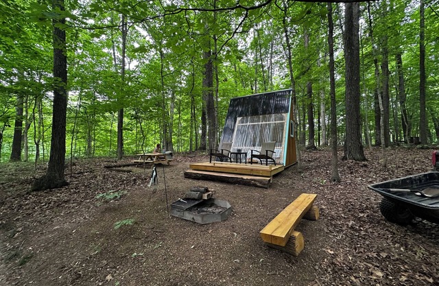 Charming A-frame cabin set in the woods overlooking deep wooded ravines.