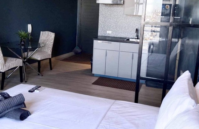 Cozy 1-bedroom condo in welcoming Makati with WiFi, AC, fitness room
