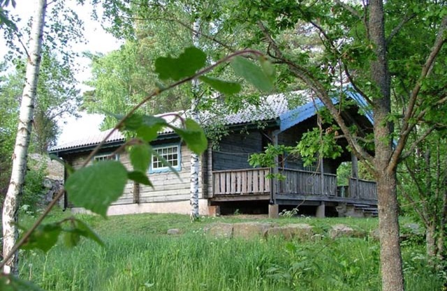Cozy log cabin near the lake in beautiful nature