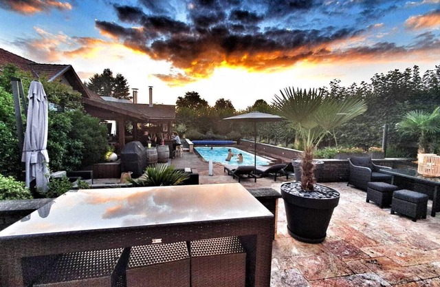 Entire floor in a fully renovated town house with swimming pool.