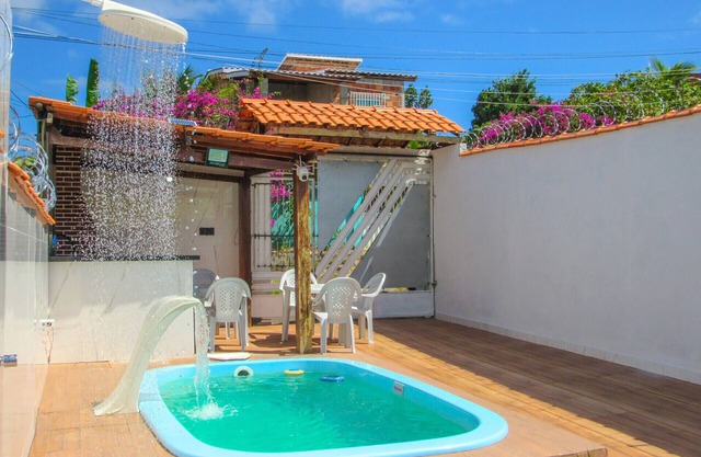 Espaço de Lazer: Casa com Piscina e Churrasqueira