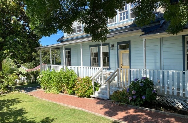 Farmhouse with Hot Tub, charming gardens, serenity, 2 blocks to Main Street!