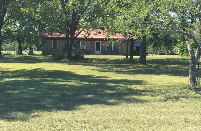 Great get away to a country home with large yard and outdoor sitting area.