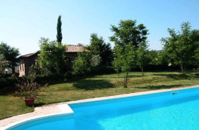 Holiday home with air conditioning, pool and private garden