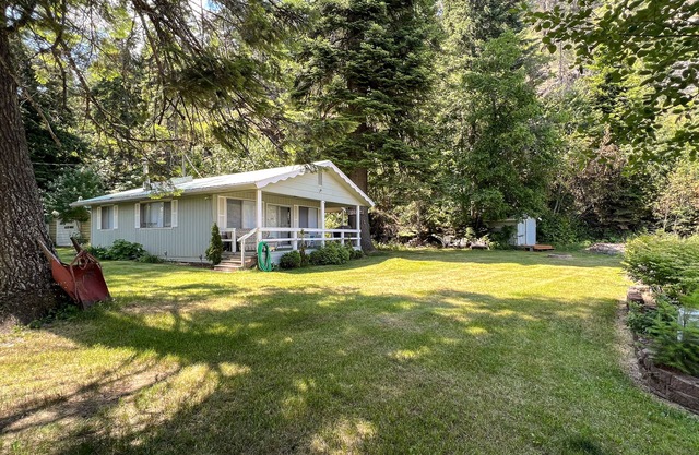 Lakefront home with private dock, large yard, wood stove, firepit, grill, W/D