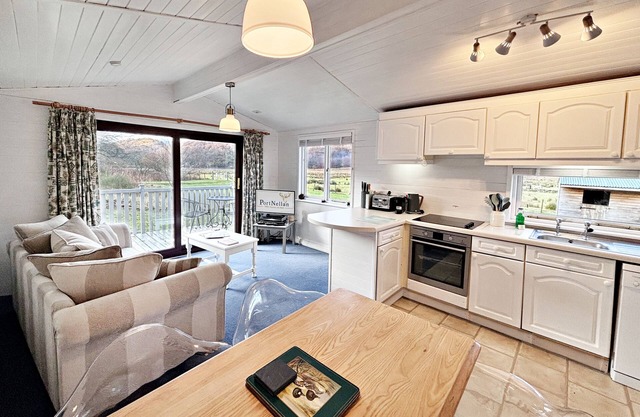 Lapwing Lodge with loch and mountain view