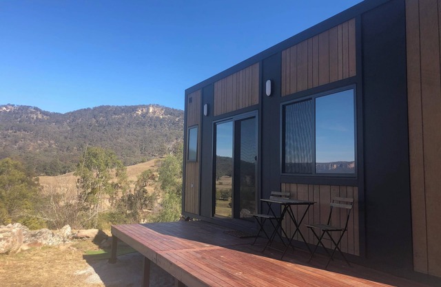 Modern cabin offering incredible views with fire pit, spa and hiking trails.
