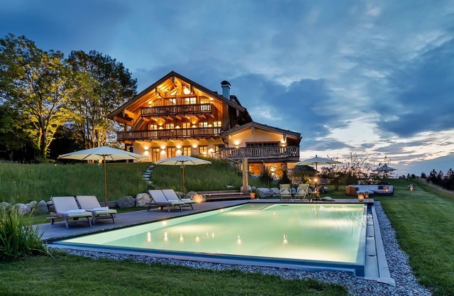 Modern chalet style with private sauna, fireplace, hot tube, pool with Chiemsee view