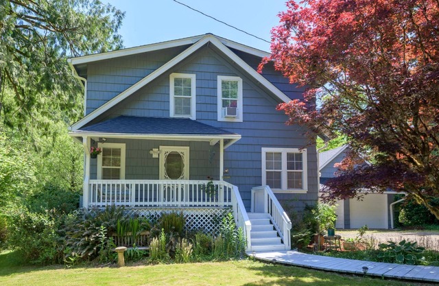 New Listing! Beautiful riverfront farm style home with amazing views and hot tub