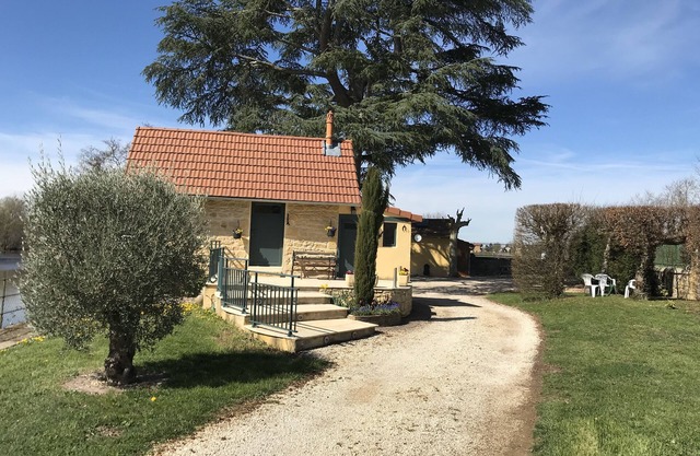Old fisherman's cottage renovated on the banks of the river sure beautiful closed ground.