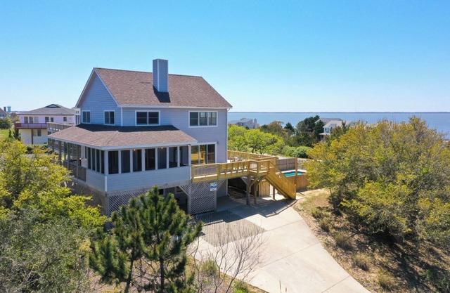Pet-friendly oceanside Duck home w/pool, hot tub, sound and sunset views!
