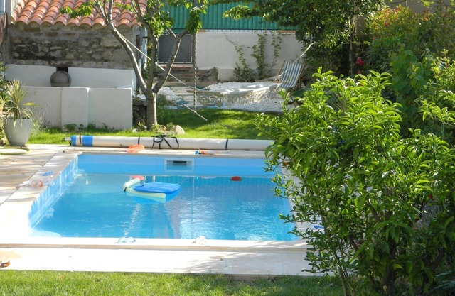 Pretty village house with private heated pool. Opposite historic church.