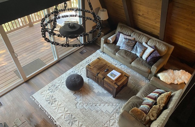 Private cabin in a small mountain town surrounded by pine trees. Snow getaway