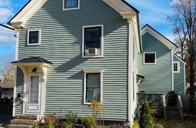 Renovated farmhouse featuring two connected rental units with an interior access door. Large Yard