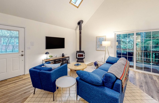 Renovated, three-story home by the beach with a furnished deck & washer/dryer