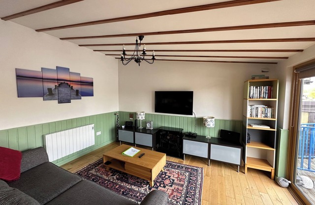 Riverside 2 bedroom lodge. Fishing straight off the decking.