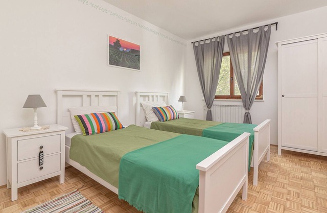 Room with two single beds