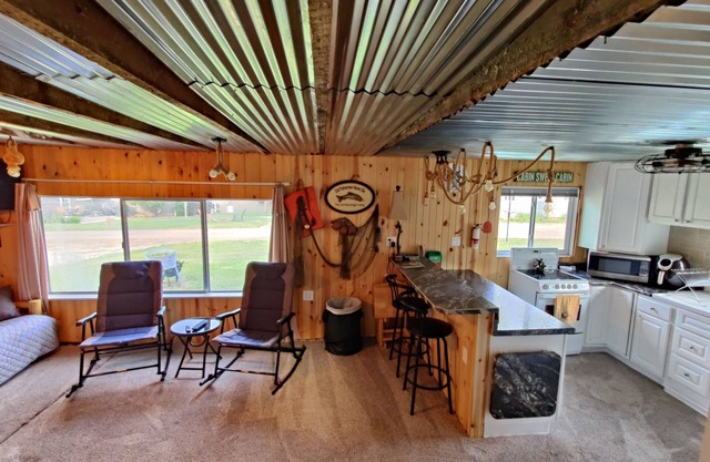 Rustic and charming two-bedroom home a block from the lake and park!