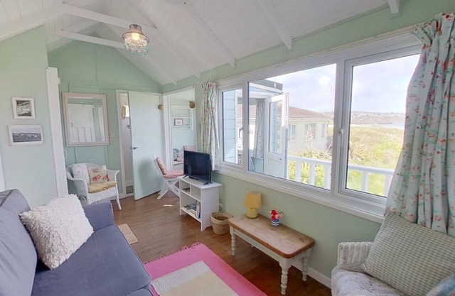 Sandford is a charming, traditional beach chalet, with great sea views.