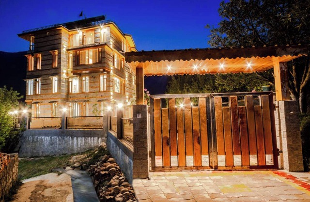 Stone and wood cosy chalet admist apple garden with a beautiful law