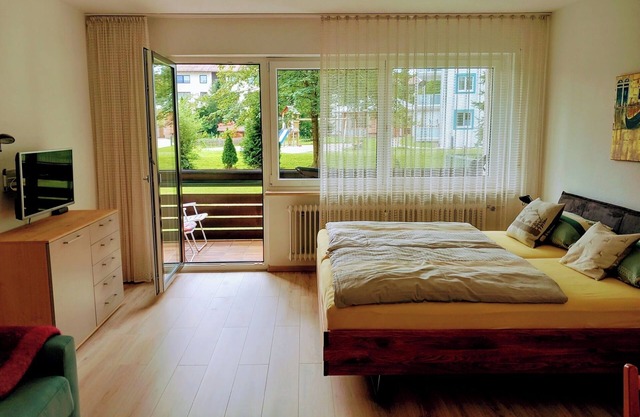 Studio Apartment 'Isarnähe' with shared garden, balcony and wifi