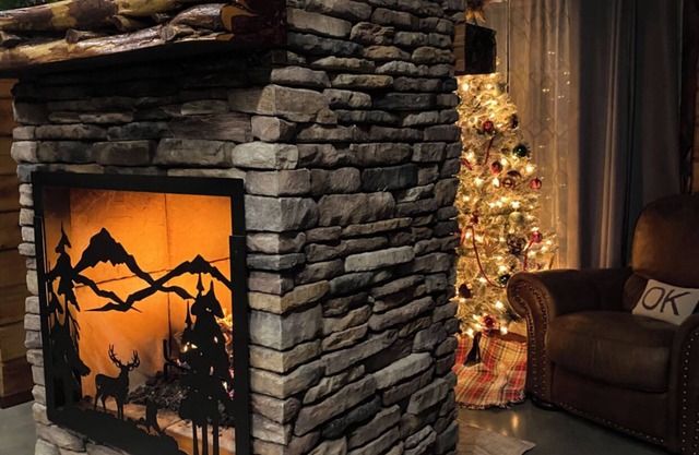 The Cozy Pines is a newly built, romantic log cabin with a 2-sided fireplace.