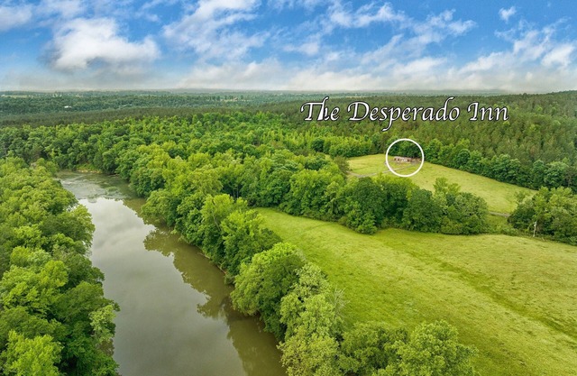 The Desperado Inn is a charming secluded cabin with Mountain Fork River access