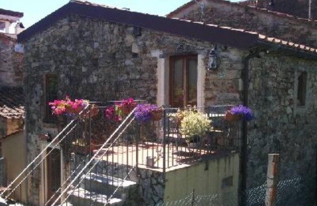 The old farmhouse among vineyards and olive groves