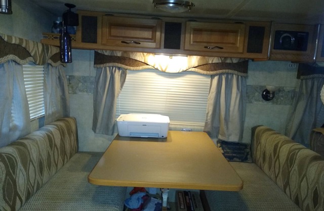 this is a very spacious RV that sits under 2 large trees